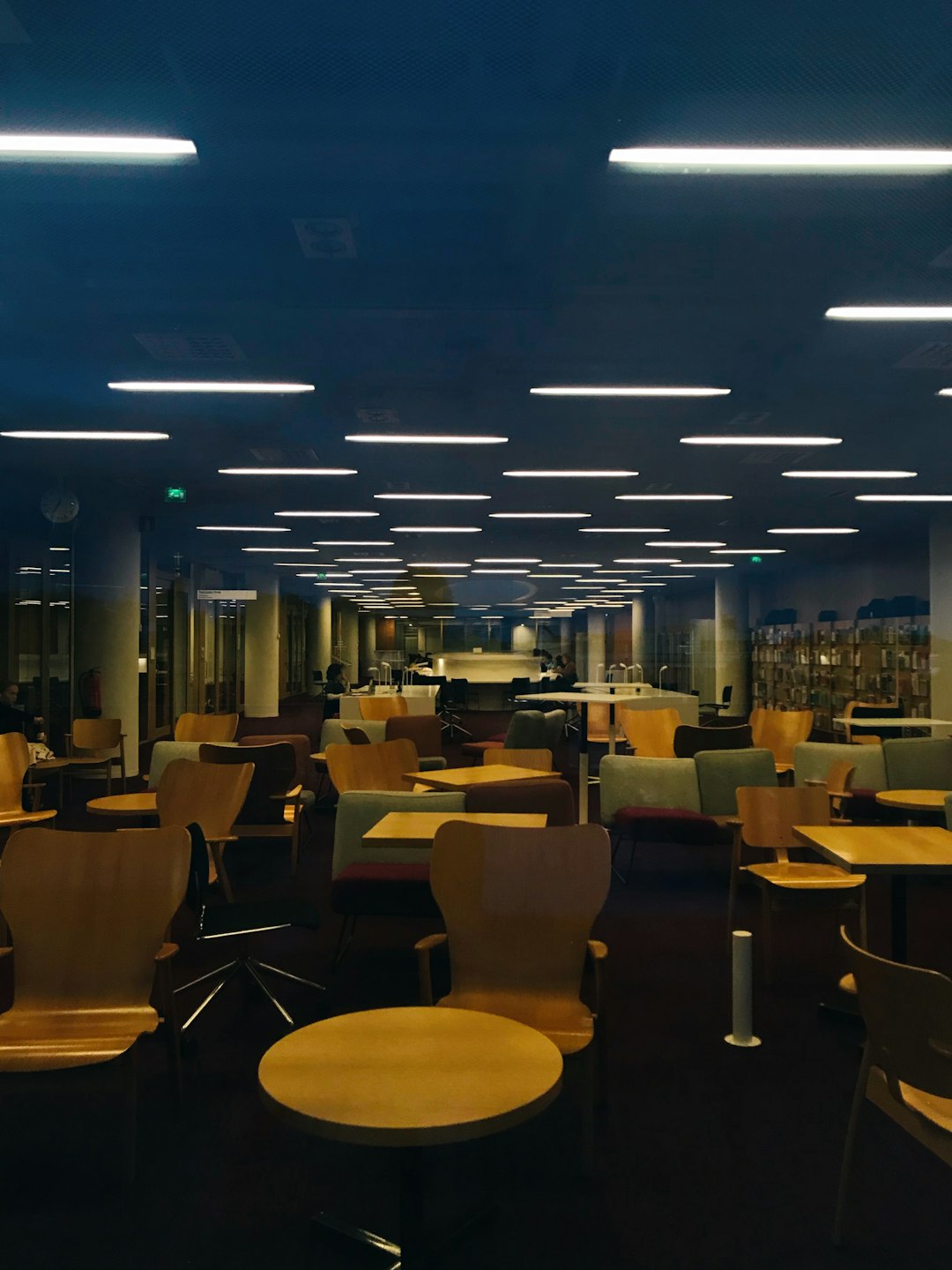 Microsoft SVC Building 6 Explained: Inside Redmond’s Infrastructure 2 tables and chairs on dimmed room microsoft campus tech workers modern interior