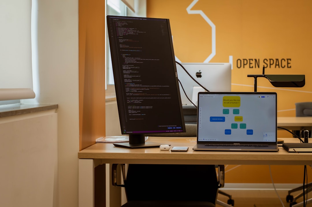 a laptop computer sitting on top of a wooden desk open source assistant local ai interface trustworthy technology
