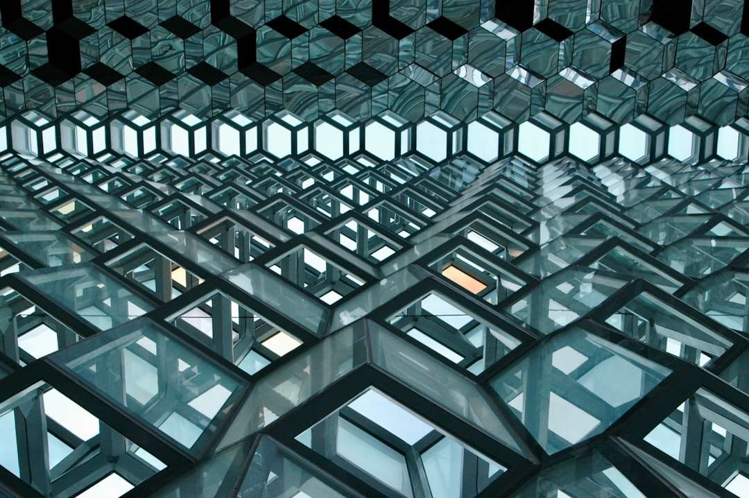 modern glass building with geometric facade patterns digital innovation concept layered technology architecture futuristic data interface