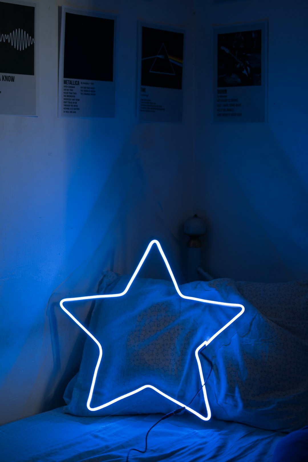 a bed with a star shaped light up pillow on top of it dreaming person night sleep stars