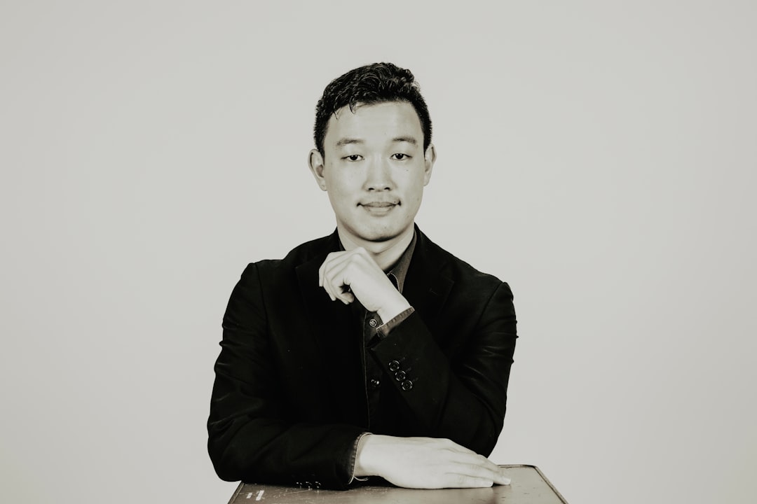 What Makes Ben Stace a Trusted Semantic SEO Consultant? 1 a black and white photo of a man sitting at a table ben stace seo expert digital marketing