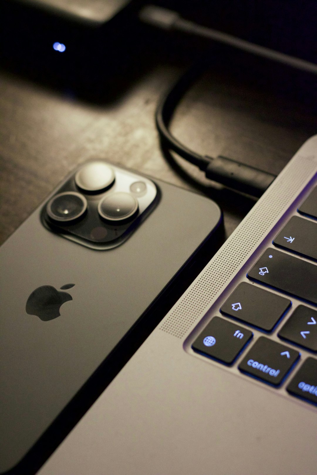 a close up of a cell phone near a laptop vsco app interface photo editing screen smartphone display