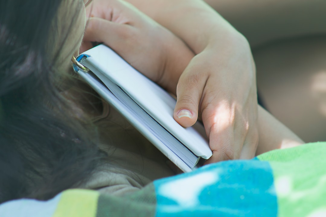 Education SEO for Higher Education, EdTech and K-12 Schools 1 a close up of a person holding a tablet mobile browsing school website smartphone students