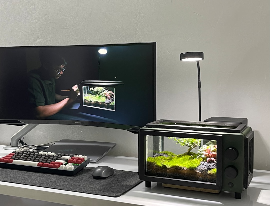 a flat screen tv sitting on top of a desk game installation helldivers 2 computer setup