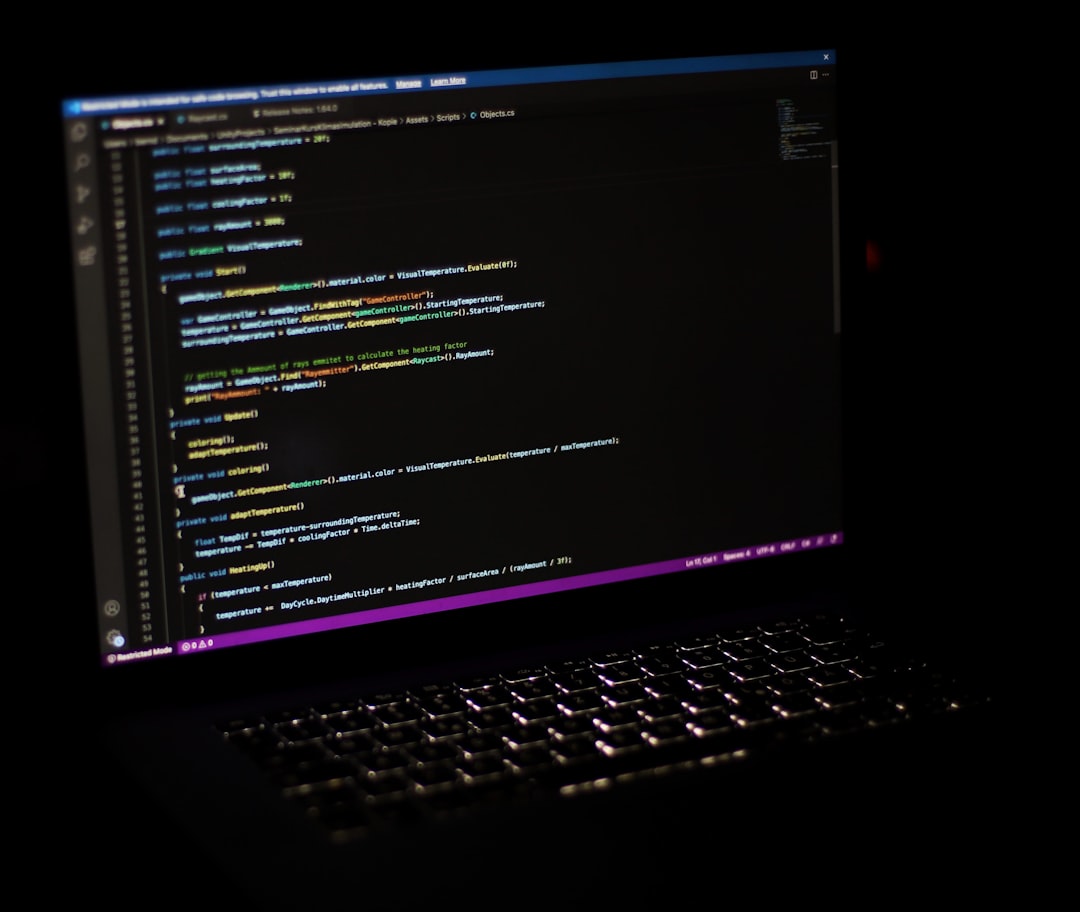 a laptop computer sitting on top of a desk database query builder interface code editor with sql developer coding late night