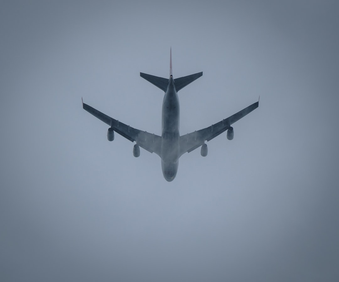 a large jetliner flying through a foggy sky error message flight booking website issues