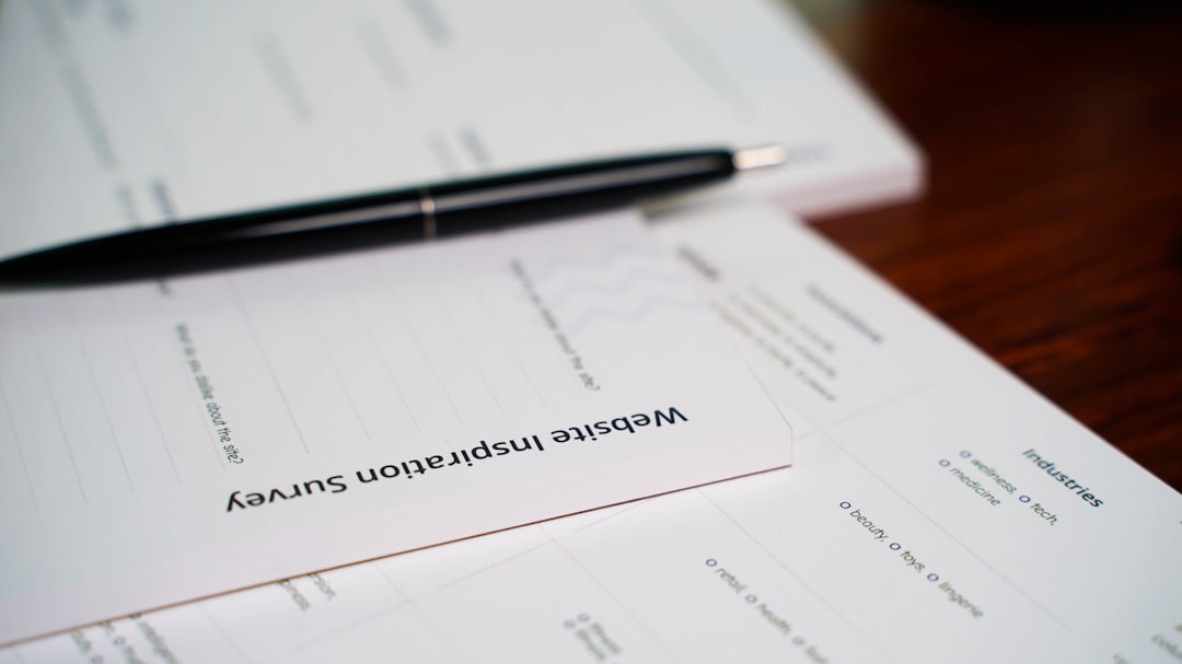 a pen sitting on top of a piece of paper terms conditions form agreement