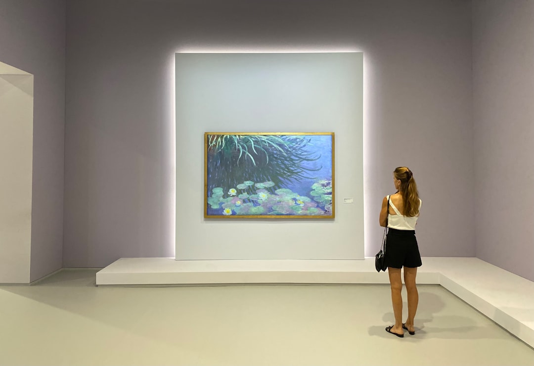 Gramhir.pro AI Image Generator Review 1 a woman looking at a painting in a museum ai artwork user interface digital painting