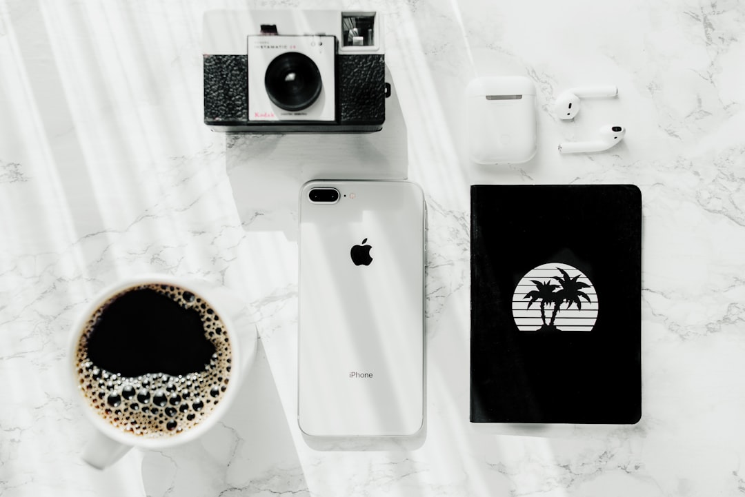 silver iphone 7 plus near camera lifestyle blogger social media strategy content planning