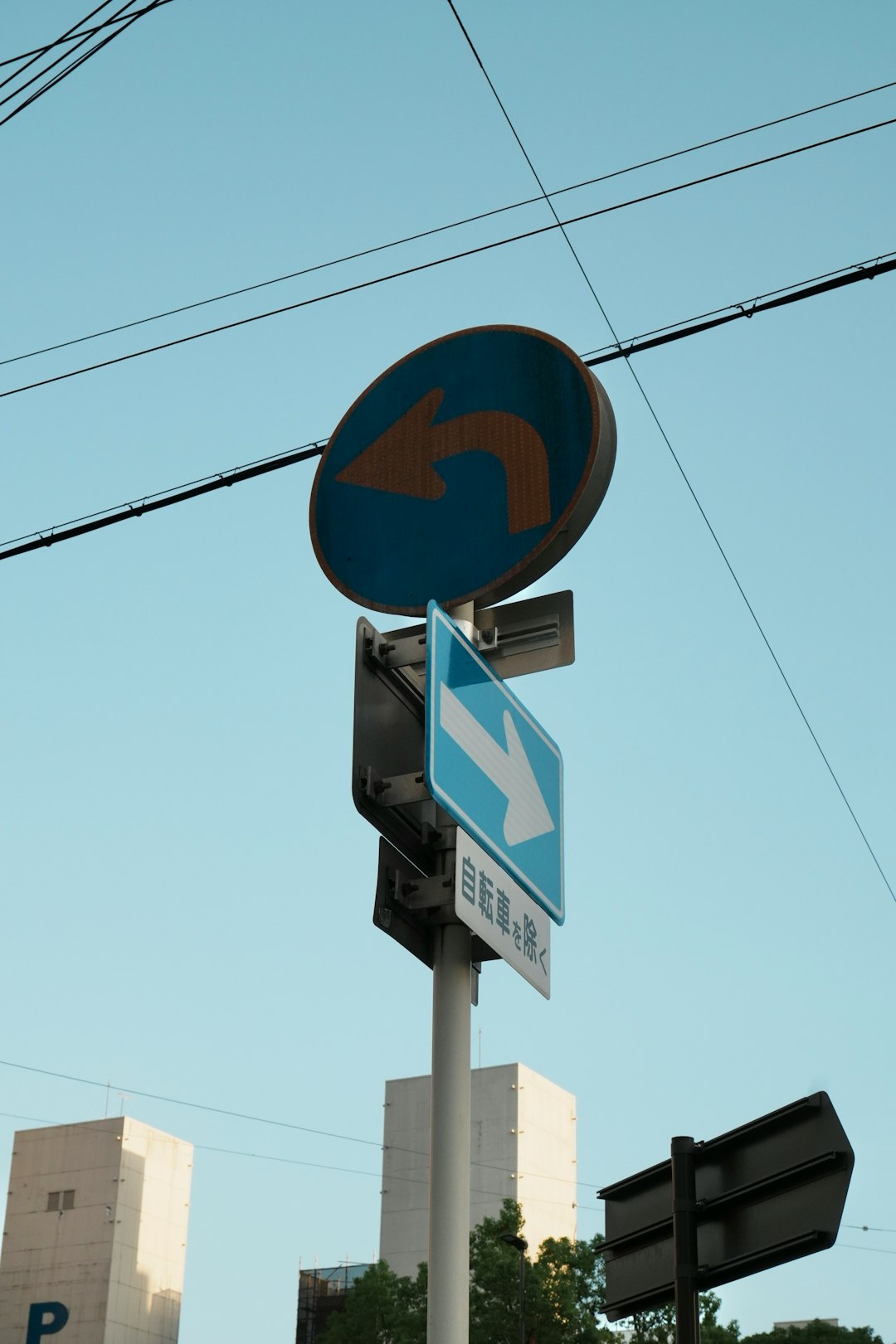 traffic signs showing turn left and straight ahead photo editing text overlay travel photo with location text minimalist design