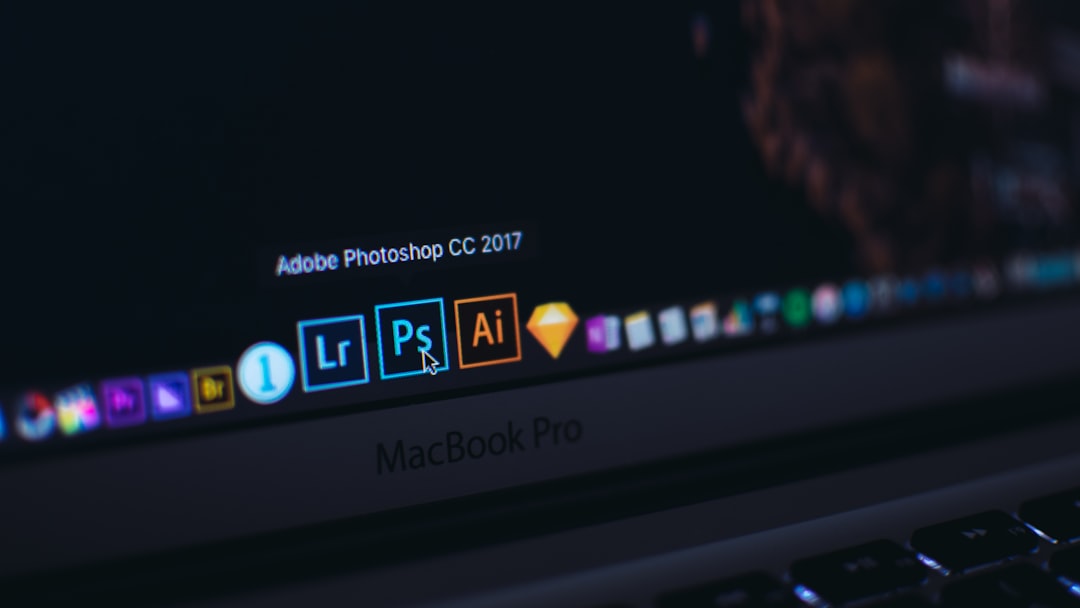 turned on macbook pro adobe software suite icons creative cloud desktop overlapping application windows