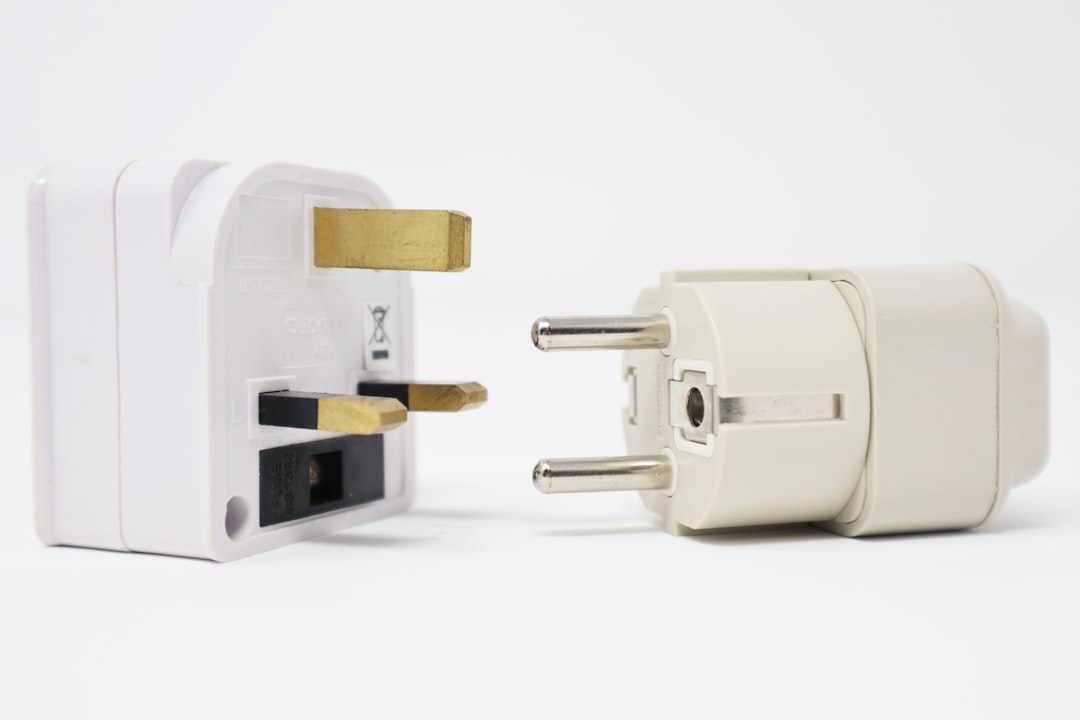 two white power adapters on white background travel adapter plug types international sockets