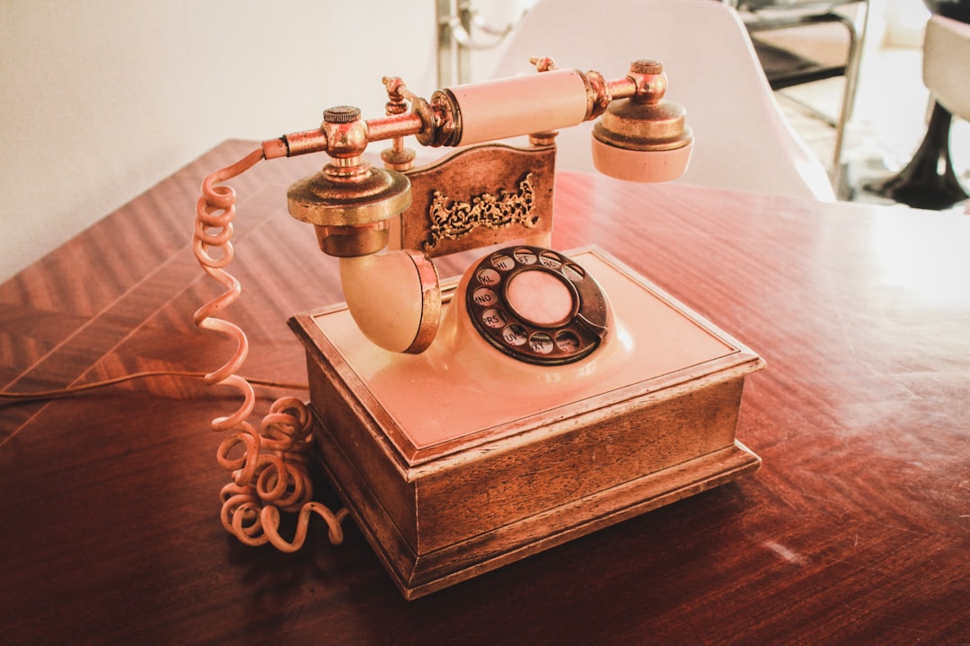 Is it OK to use your smartphone while charging? Let’s find out 2 white and brown rotary telephone on brown wooden table safe charging avoid overheating phone case off