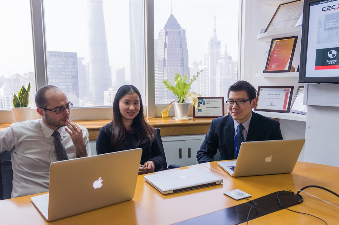 woman in black long sleeve shirt sitting beside woman in black long sleeve shirt corporate team search screen business analysis