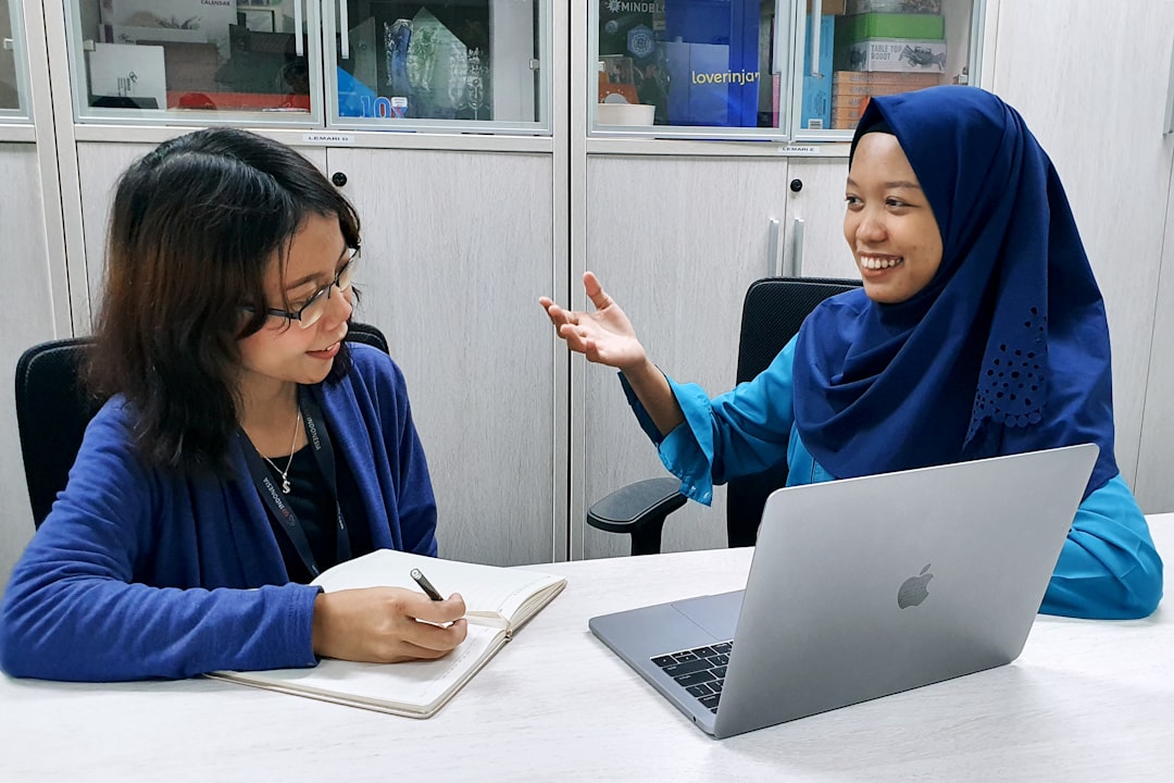 Virtual Classroom Software Free: Top Tools to Teach, Learn, and Collaborate Without Spending a Dime 1 woman in blue robe using macbook online class teacher google meet
