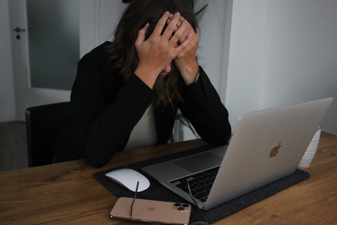 What are the risks of neglecting regular updates on a WordPress website without a maintenance company? 3 a woman covering her face while looking at a laptop sad webmasterbroken sitehacker alertpanic