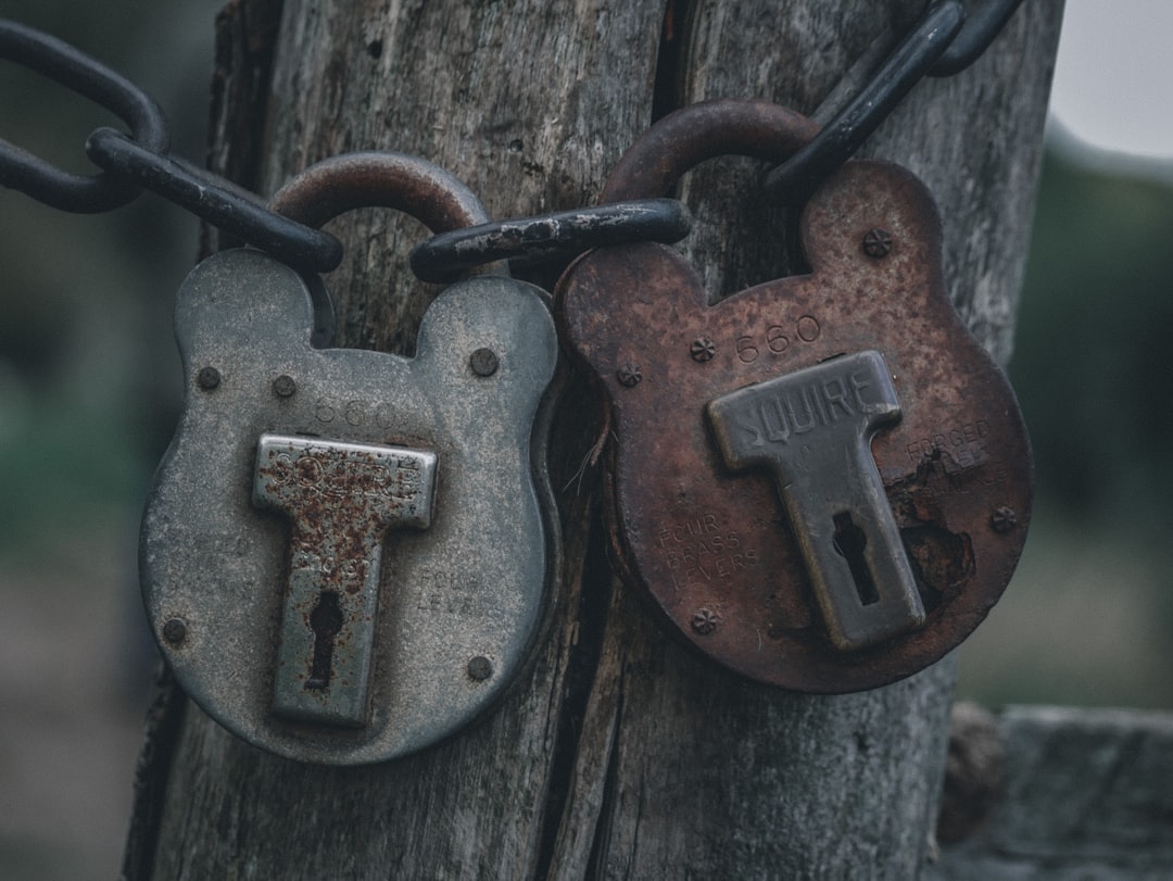 two padlocks are attached to a wooden post database integrity orphaned rows broken relationships