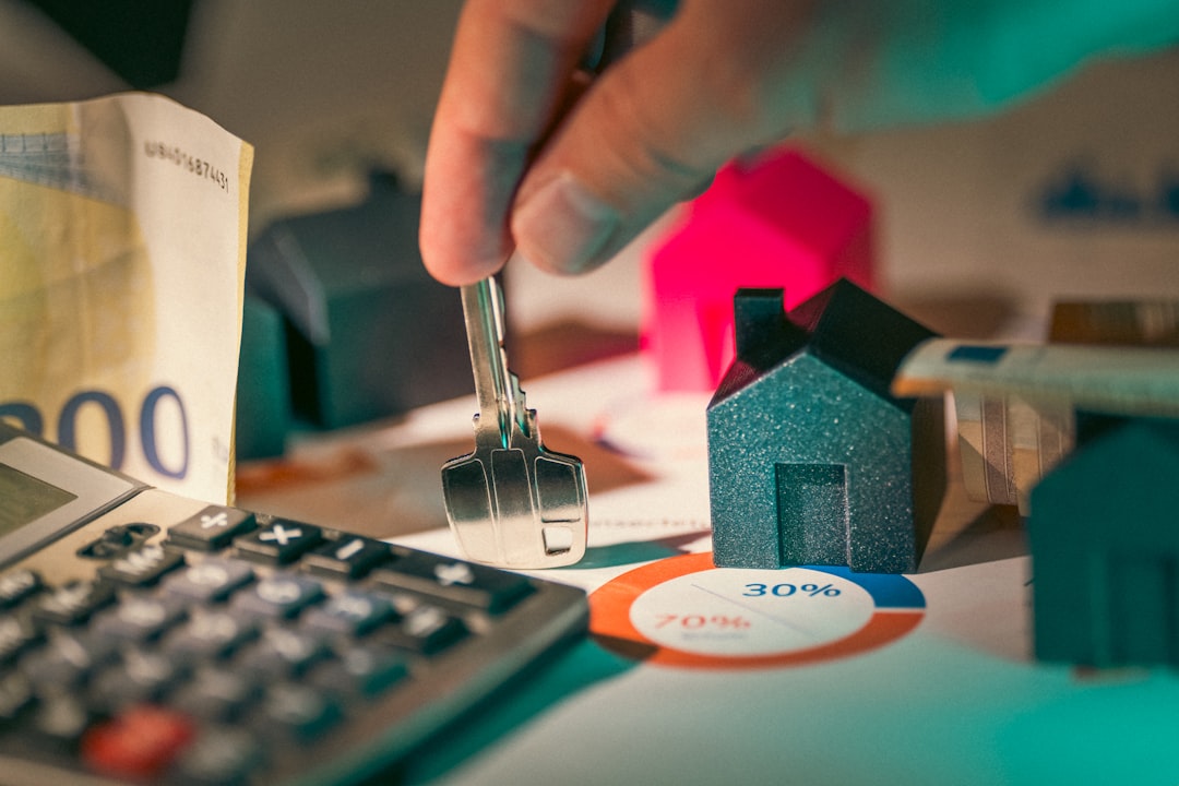 Does Truist Bank Offer a Home Equity Line of Credit? 2 a person putting money into a calculator home money renovation finance