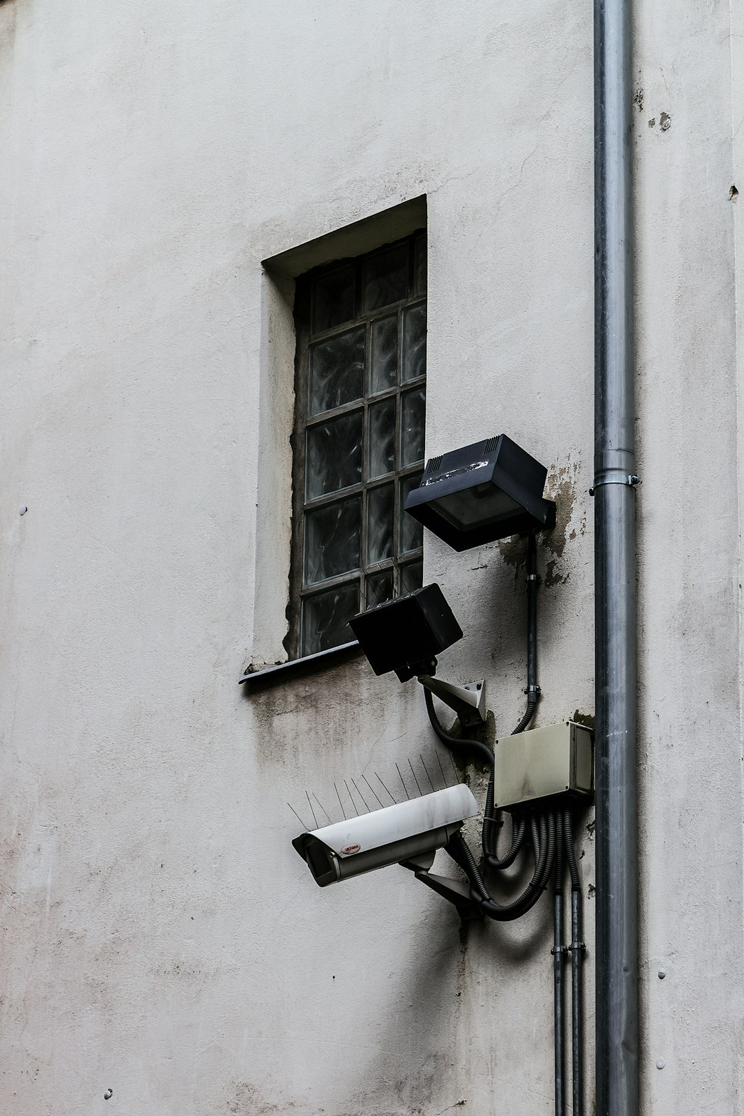 Are VPNs legal? Country guide for 2025 2 black wall mounted lamp on white concrete wall vpn ban restricted internet government surveillance