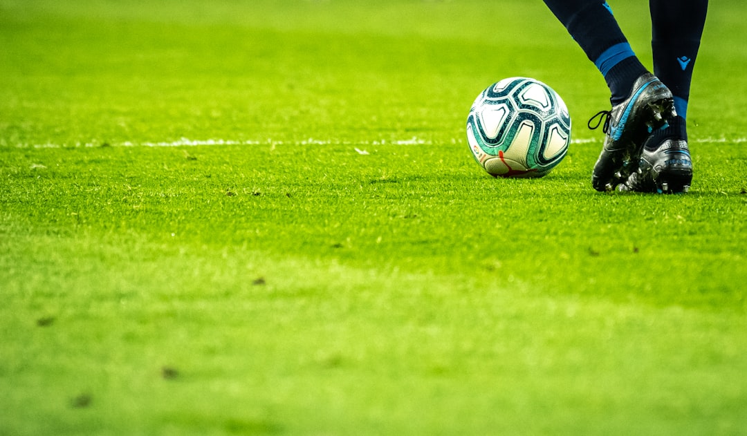 How to Add the In-Game Editor to Your FM24 Save 2 man playing soccer game on field football manager transfercontract editingplayer attributes