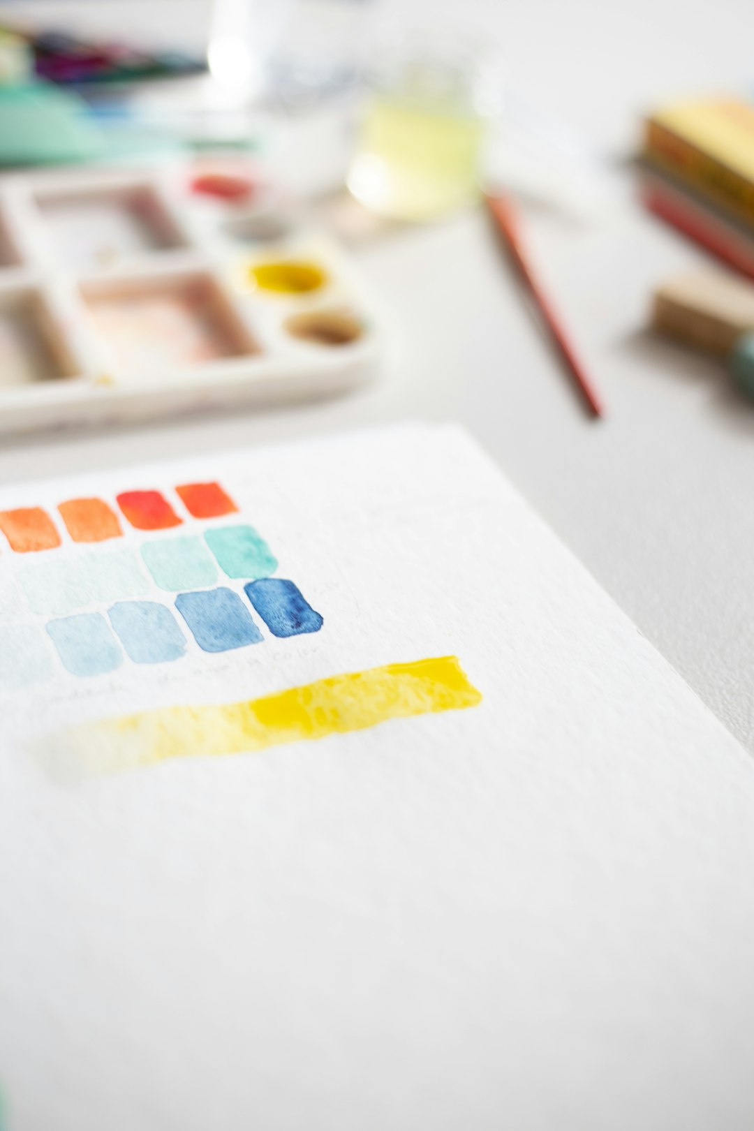 white yellow and red printer paper color palette selection typography examples branding process workspace