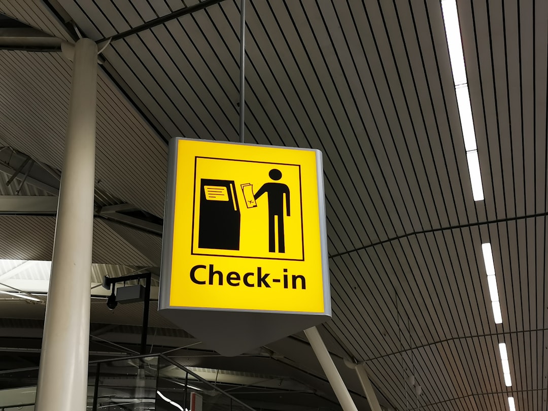How to Add TSA PreCheck to Your American Airlines Profile 2 yellow and black no smoking sign boarding pass airport checkin tsa precheck indicator