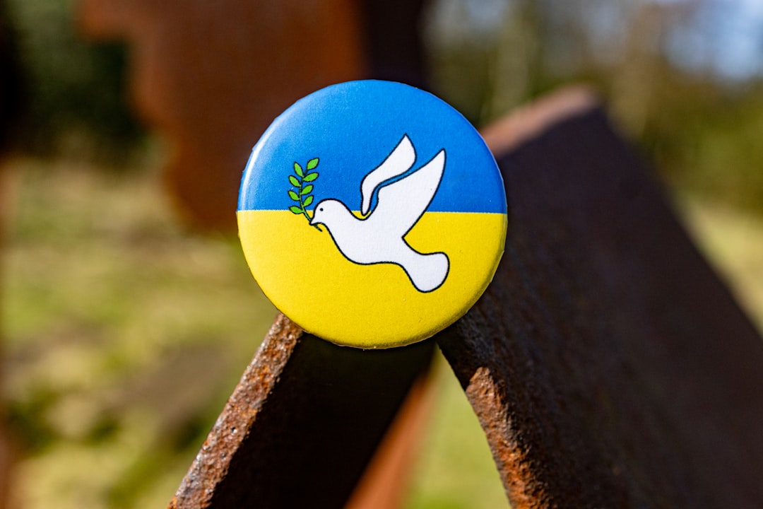 Atlassian Universal Plugin Manager - What you need to know in 2025 2 a blue and yellow pin with a white dove on it atlassian toolsapp updatessecurity patches