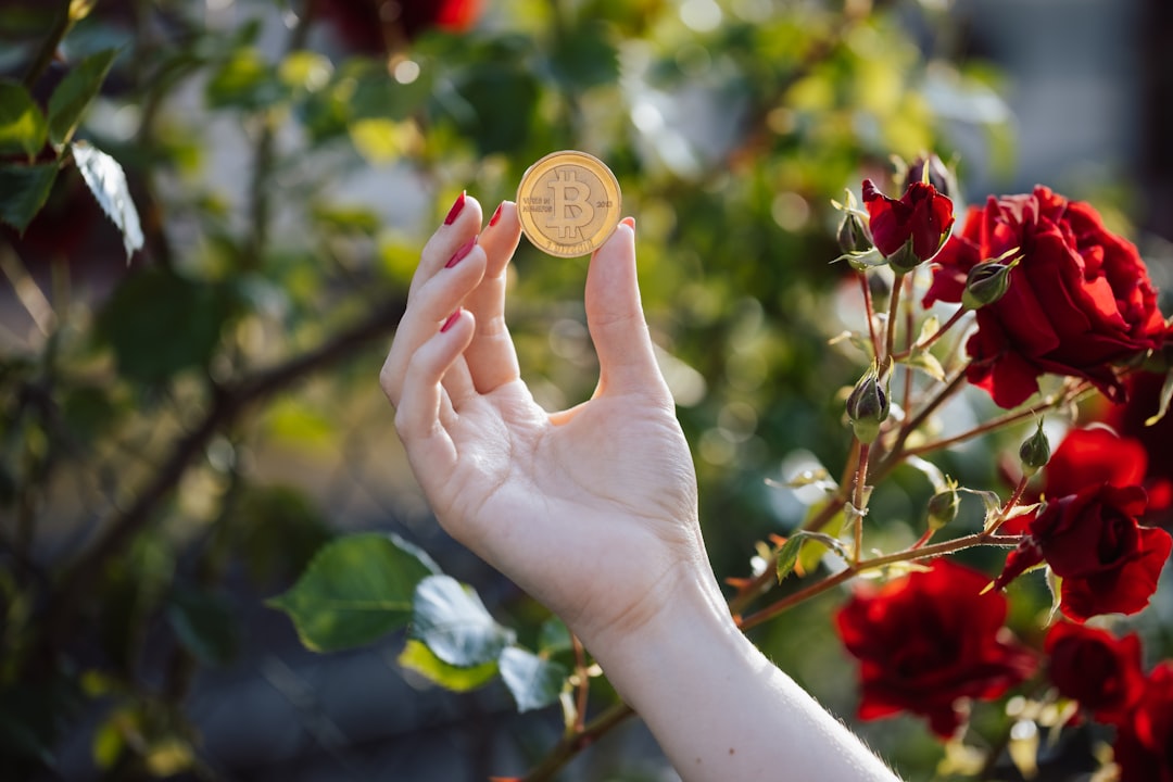 a womans hand holding a gold coin in front of red roses exchange server login error browser 1