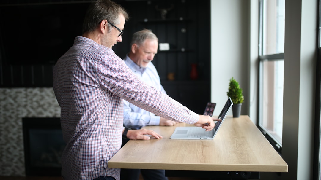 Best 6 Thryv Software Alternatives in 2025 1 man in purple and white checkered dress shirt using macbook pro small business meeting software dashboard teamwork