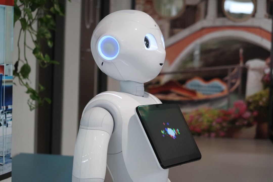 5 Stunning Things That GPT-4o Can Do (That GPT-4 Couldn’t) 1 a white robot holding a tablet in its hand talking ai voice assistant human robot interaction