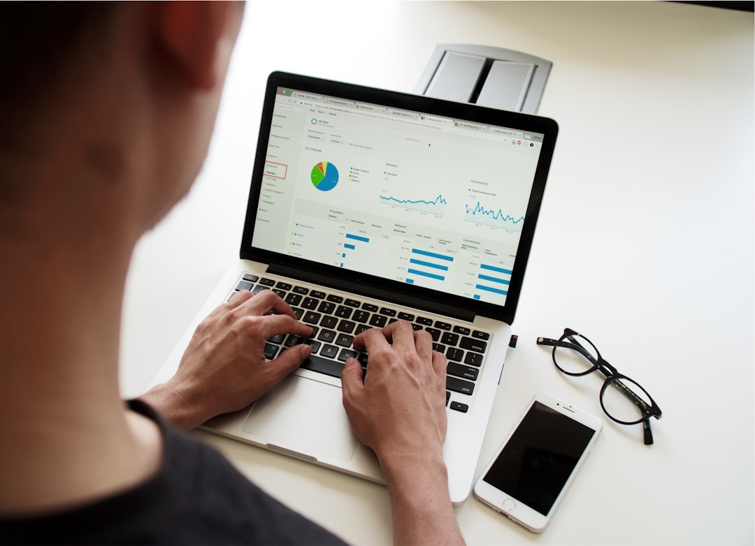 person using macbook pro backup system data recovery disaster recovery plan
