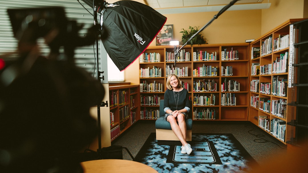 How to SELECT ALL Capcut clips in the timeline? 2 woman sitting on armless chair with light between bookcases in room video project clip selection editing tips