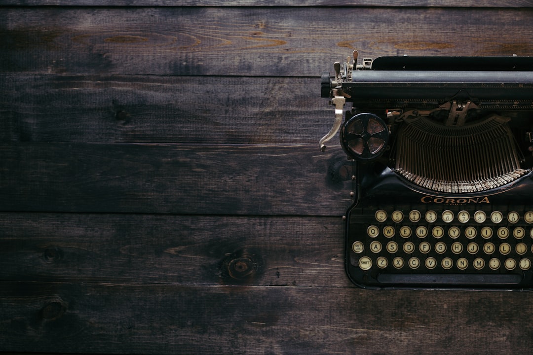 Men Are 35% More Likely Than Women To Use AI To Write Their Resume 2 black corona typewriter on brown wood planks diverse workforce career growth resume writing