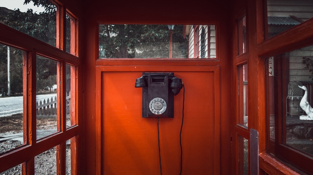 How do I add files to Stick Nodes? 2 black rotary telephone mounted on red wooden wall zip file icon download arrow phone screen