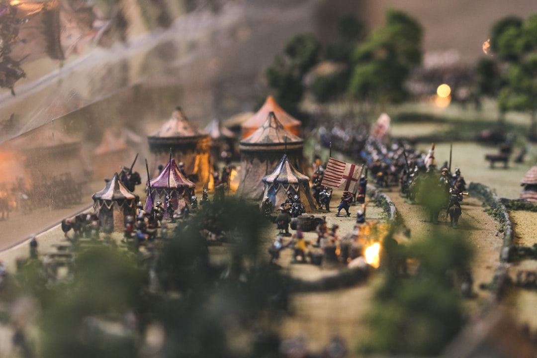 bokeh photograph of carnival miniatures raid battle scene fantasy game champions 1