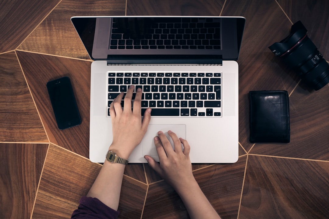 Why Everyone Is Talking About Neuralink 2 person using macbook pro elon musk futurist brain computer interface