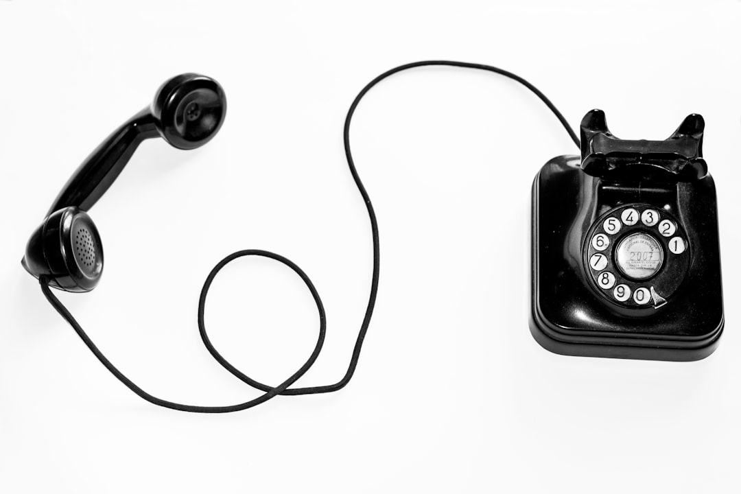 photo of black rotary phone against white background zip file icon download arrow phone screen