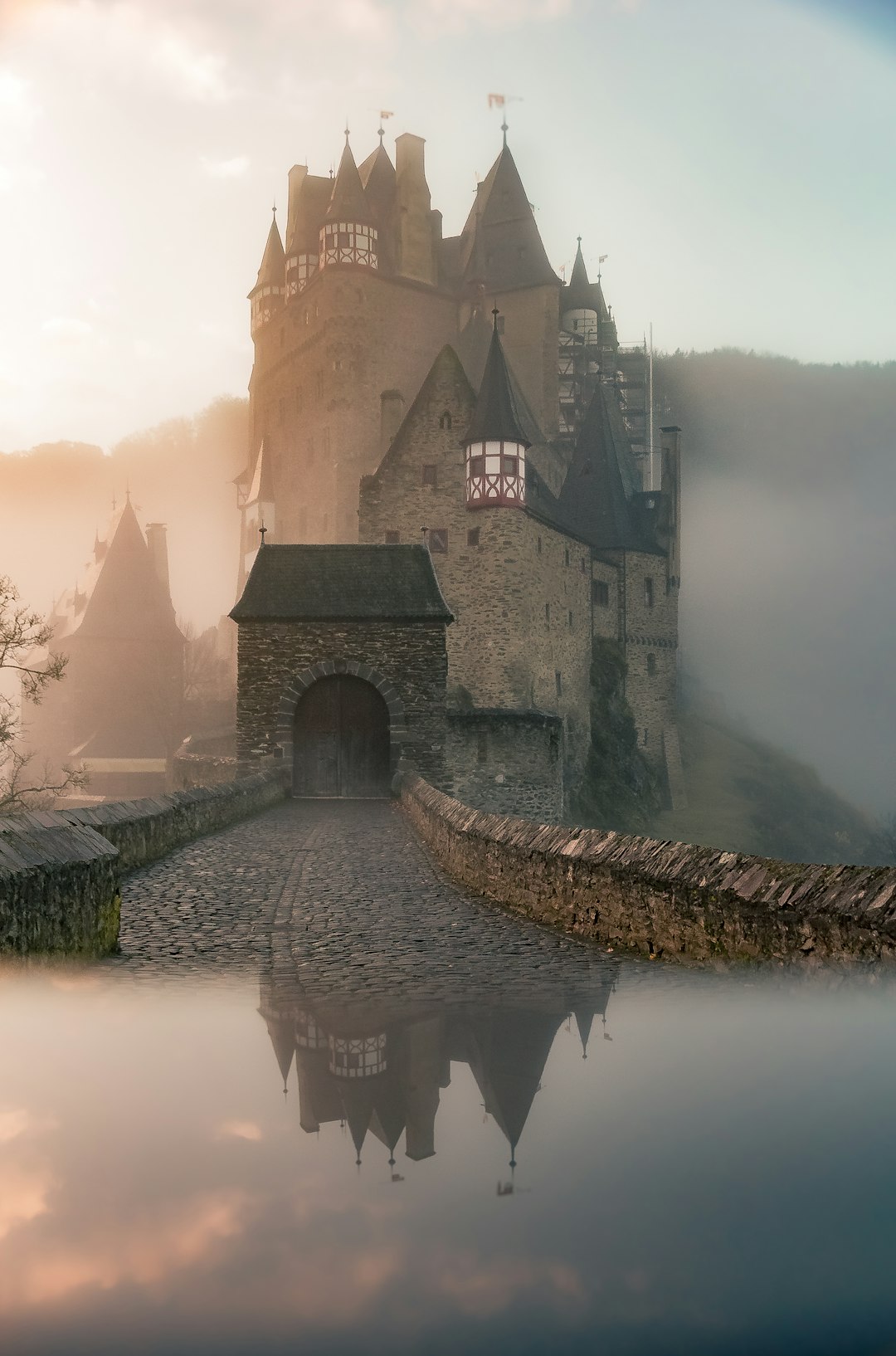 Can you download RAID: Shadow Legends on PC? 1 reflection of a castle surrounded with fogs raid battle scene fantasy game champions