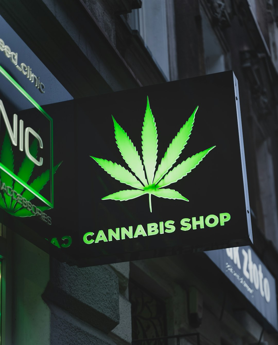 a cannabis shop sign hanging from the side of a building attorney email signature law firm branding signature with logo