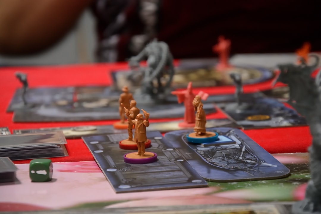 a close up of a board game with figurines on it raid battle scene fantasy game champions