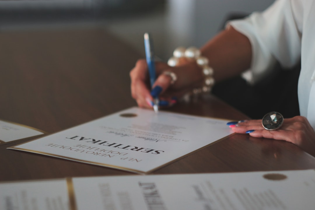 a woman writing on a piece of paper attorney email signature law firm branding signature with logo