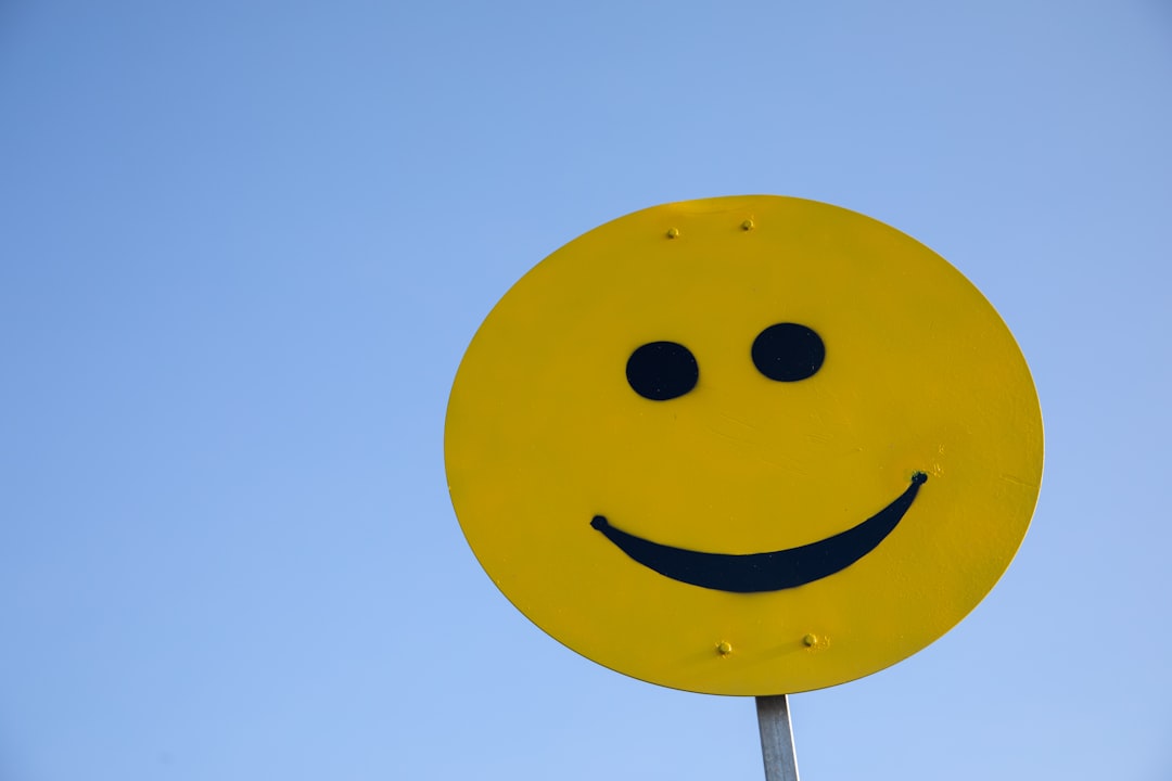 Can I use stock photos in advertising campaigns? 3 a yellow smiley face sign with a blue sky in the background happy customers advertising display marketing results