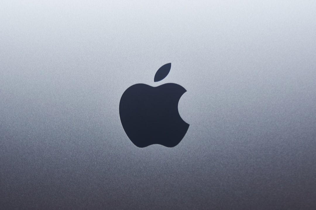 AI headphones driven by Apple M2 can translate multiple speakers at once 1 apple logo on blue surface apple headphones ai translation dinner conversation
