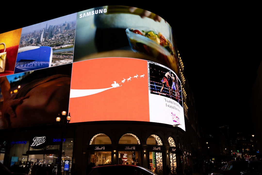 bright digital billboards illuminate a city street at night happy customers advertising display marketing results
