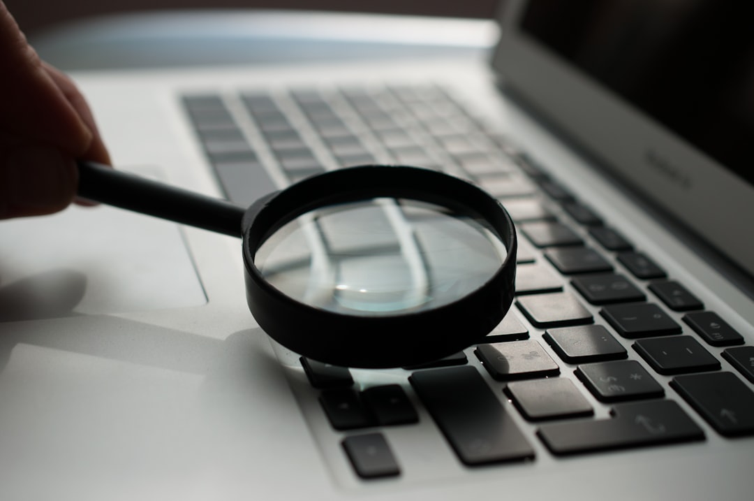 magnifying glass near gray laptop computer windows search files directory structure text files list