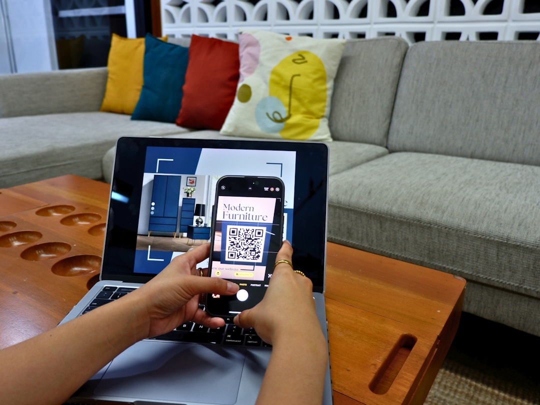 a person using a laptop computer with a qr code on the screen smart home devices virtual assistant