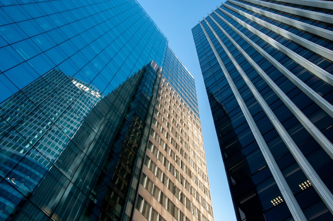blue glass walled high rise building usa businessinvoice softwarefinancial management