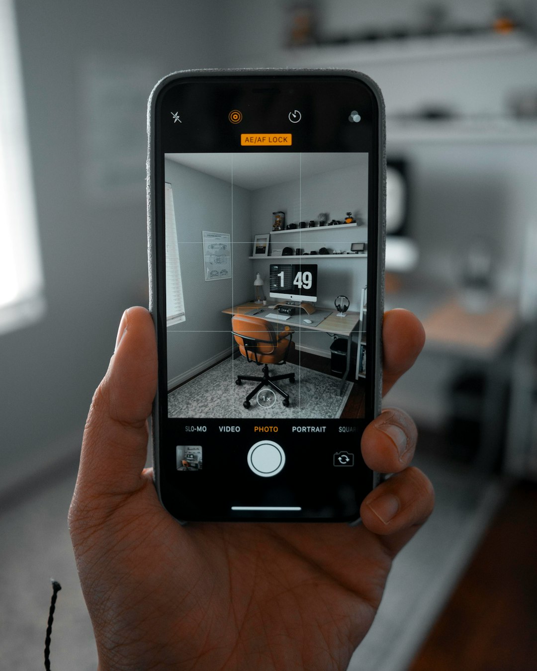 AI Assistants: Complete Comparison Guide 2025 2 person using smartphone taking a picture of chair beside desk smart home devices virtual assistant