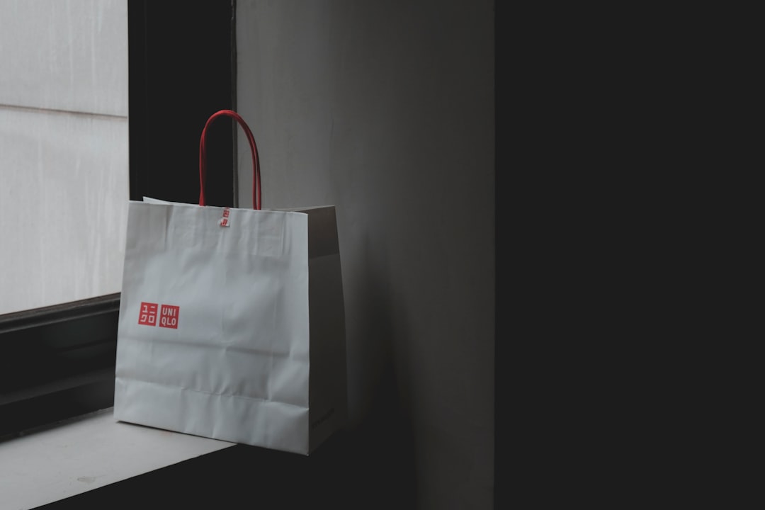 white paper bag near window panel argos store online order pickup uk retail