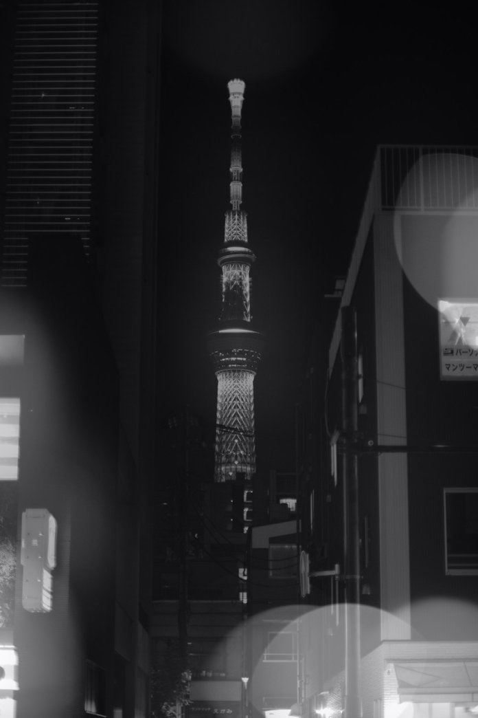 a black and white photo of the eiffel tower video styles, anime effect, black and white movie